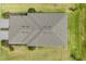 An aerial view showcases the roof of the house and the well maintained surrounding lawn and landscaping at 2072 Mackerel St, Port Charlotte, FL 33953