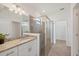Bathroom vanity with granite countertops and glass-enclosed shower at 2072 Mackerel St, Port Charlotte, FL 33953