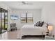 Bedroom with a TV and view to the outside and access to lanai at 2072 Mackerel St, Port Charlotte, FL 33953