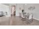 Dining area with modern table, tile floors, and access to the living area at 2072 Mackerel St, Port Charlotte, FL 33953