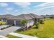 Beautiful single-story home with a well-manicured lawn and a two-car garage in a sunny location at 2072 Mackerel St, Port Charlotte, FL 33953