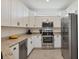 Kitchen with stainless steel appliances, white cabinetry, and granite countertops at 2072 Mackerel St, Port Charlotte, FL 33953