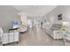Spacious living room with tiled flooring, modern furniture, and an open layout for entertaining at 2072 Mackerel St, Port Charlotte, FL 33953