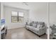 Living room with a sofa and view to outside at 2072 Mackerel St, Port Charlotte, FL 33953