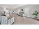 Bright, open living room featuring tile floors, modern decor, and plenty of space for comfortable living at 2072 Mackerel St, Port Charlotte, FL 33953