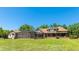 Expansive backyard featuring a screened enclosure, perfect for outdoor entertaining at 222 High Point Dr, Venice, FL 34292