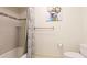 Full bathroom with modern fixtures and tiled walls and floors, as well as unique decorations at 222 High Point Dr, Venice, FL 34292