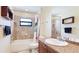 Bathroom with combination shower and tub, tiled walls, and updated fixtures at 222 High Point Dr, Venice, FL 34292
