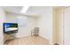 Well-lit bedroom featuring neutral walls, tile flooring, and a window for natural light at 222 High Point Dr, Venice, FL 34292