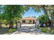 Inviting entrance with decorative pillars and a well-manicured front yard at 222 High Point Dr, Venice, FL 34292