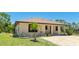 Home featuring a well-manicured lawn and a brick-paved driveway at 222 High Point Dr, Venice, FL 34292