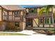 Inviting two-story home with brick accents, a balcony, and manicured landscaping at 222 High Point Dr, Venice, FL 34292