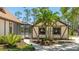 Charming guesthouse with manicured landscaping, creating a welcoming and picturesque outdoor setting at 222 High Point Dr, Venice, FL 34292