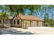 Spacious three-car garage with well-maintained landscaping, enhancing the curb appeal of this lovely home at 222 High Point Dr, Venice, FL 34292
