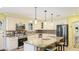Kitchen with stainless steel appliances, granite countertops and tiled backsplash at 222 High Point Dr, Venice, FL 34292