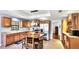 Modern kitchen featuring wood cabinetry, stainless steel appliances, and a functional center island at 222 High Point Dr, Venice, FL 34292