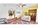 Open living area with hardwood floors and bar area at 222 High Point Dr, Venice, FL 34292
