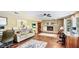 Large living room features a fireplace, wood floors and built in shelving at 222 High Point Dr, Venice, FL 34292