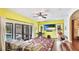 Bright living area features hardwood floors, ceiling fan and access to outdoor pool at 222 High Point Dr, Venice, FL 34292