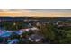 High angle aerial view featuring the home's location, pool, and cityscape beyond at 2632 Hawthorne St, Sarasota, FL 34239