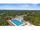 A beautiful aerial shot of a large swimming pool with a beautiful cityscape in the background at 2632 Hawthorne St, Sarasota, FL 34239