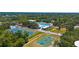 An aerial view of a neighborhood swimming pool, tennis court, and basketball court at 2632 Hawthorne St, Sarasota, FL 34239