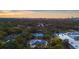 Wide aerial shot showcasing the home's location, pool and lush greenery nearby at 2632 Hawthorne St, Sarasota, FL 34239