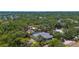 Aerial view of home with screened in pool in a leafy neighborhood at 2632 Hawthorne St, Sarasota, FL 34239