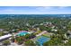 Aerial view showcasing a swimming pool, tennis court, and basketball court in the city at 2632 Hawthorne St, Sarasota, FL 34239