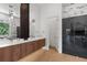Modern bathroom with double vanity, marble accents, and a luxurious shower with glass enclosure at 2632 Hawthorne St, Sarasota, FL 34239