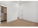 Bright bedroom with natural light, hardwood floors, closet, and modern white door at 2632 Hawthorne St, Sarasota, FL 34239