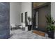 Chic front porch with seating, potted plants, and a modern front door design at 2632 Hawthorne St, Sarasota, FL 34239