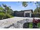 Beautifully landscaped modern home featuring a spacious driveway and a sleek two-car garage at 2632 Hawthorne St, Sarasota, FL 34239