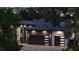 Beautiful home exterior showcasing elegant architectural details, dark tiled roof, and a well-manicured lawn at 2632 Hawthorne St, Sarasota, FL 34239