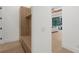 Hallway view showcasing custom millwork, white walls, and wood flooring at 2632 Hawthorne St, Sarasota, FL 34239