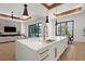 Open concept kitchen with island and seating, connecting the living spaces at 2632 Hawthorne St, Sarasota, FL 34239
