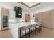 Spacious kitchen with island seating, pendant lighting, and wood cabinets at 2632 Hawthorne St, Sarasota, FL 34239