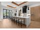 Modern kitchen with island seating, pendant lights, and stainless steel appliances at 2632 Hawthorne St, Sarasota, FL 34239