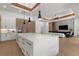 Large kitchen island with seating, opening to the living room and dining areas at 2632 Hawthorne St, Sarasota, FL 34239
