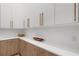 Bright kitchen featuring two-tone cabinetry, white countertops and modern hardware at 2632 Hawthorne St, Sarasota, FL 34239