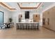Contemporary kitchen with island seating and stainless appliances, adjacent to dining area at 2632 Hawthorne St, Sarasota, FL 34239