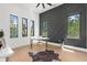 Office space featuring statement wall, ample natural light, and wood floors at 2632 Hawthorne St, Sarasota, FL 34239