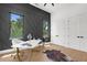 Bright office features a designer accent wall, modern desk, and dual closets at 2632 Hawthorne St, Sarasota, FL 34239