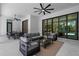 Elegant outdoor living space with comfortable seating, a dining area, and a view of the pool through large glass doors at 2632 Hawthorne St, Sarasota, FL 34239