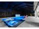 Inviting pool with hot tub and in-pool seating, illuminated for evening enjoyment at 2632 Hawthorne St, Sarasota, FL 34239