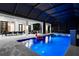 Tranquil pool area with hot tub, in-pool seating, and seamless access to indoor living at 2632 Hawthorne St, Sarasota, FL 34239