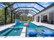This luxurious pool area features a hot tub, in-pool seating, and a relaxing spa at 2632 Hawthorne St, Sarasota, FL 34239