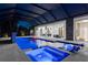 Beautifully lit pool area with hot tub, in-pool seating, and seamless indoor-outdoor living at 2632 Hawthorne St, Sarasota, FL 34239
