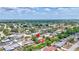 Aerial view showcases neighborhood with lush landscaping and mature trees at 3036 Rose St, Sarasota, FL 34239