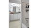 Bathroom showcasing white cabinets, granite countertop, and shower with tiled accents at 3036 Rose St, Sarasota, FL 34239